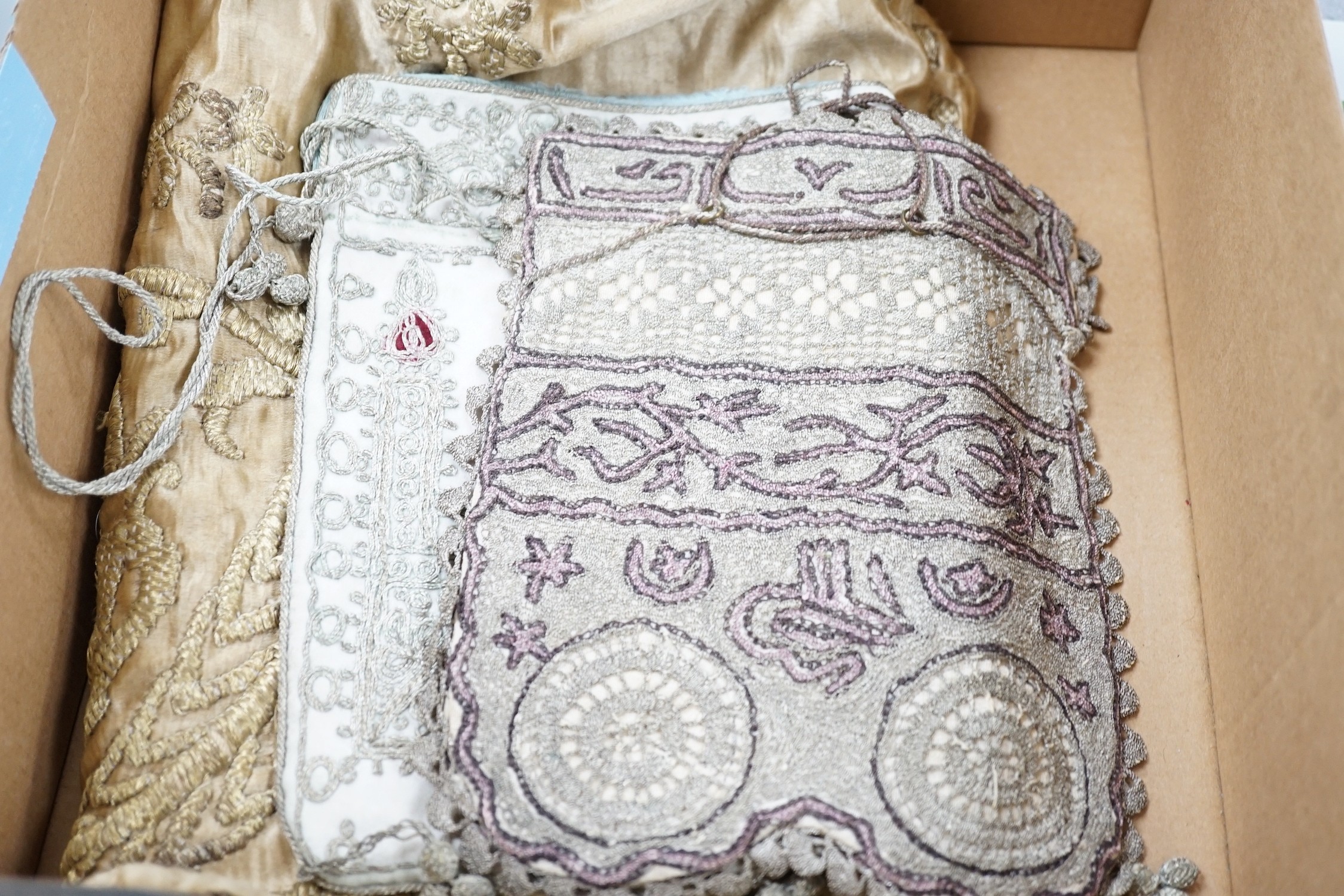 An Indian metal thread embroidered table cover and a collection of crochet, woven and embroidered bags, some with ribbon-work and cut steel and seed decoration